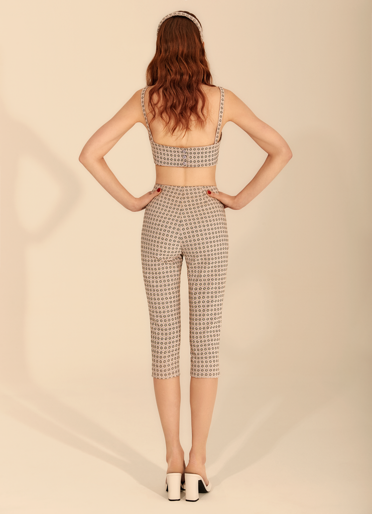 The Space Dust capri trousers | The Space Dust capri trousers in glittery silver, purple, and black, checkered flower pattern